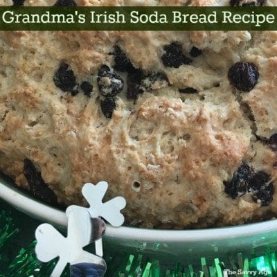 Irish soda bread with raisins in a white dish.
