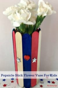Easy popsicle stick craft for kids! Enjoy the red, white and blue holidays using the dollar store, your garden and recyclable cans and bottles to make these cute little vases.