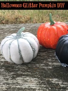 three decorated mini pumpkins with glitter