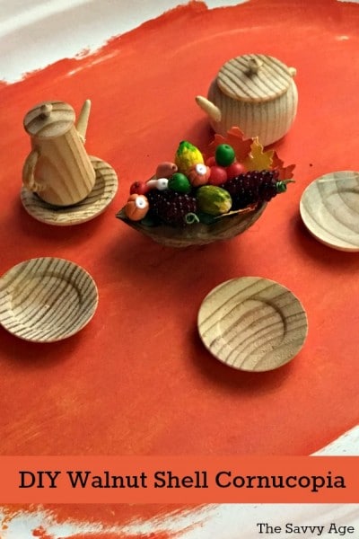 Cornucopia made of walnut shells and miniature vegetables.