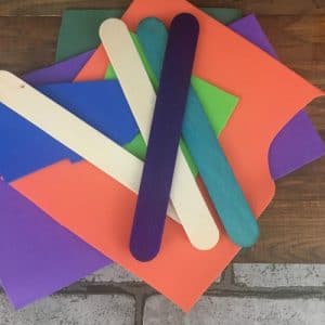 Multi colored craft paper and popsicle sticks.