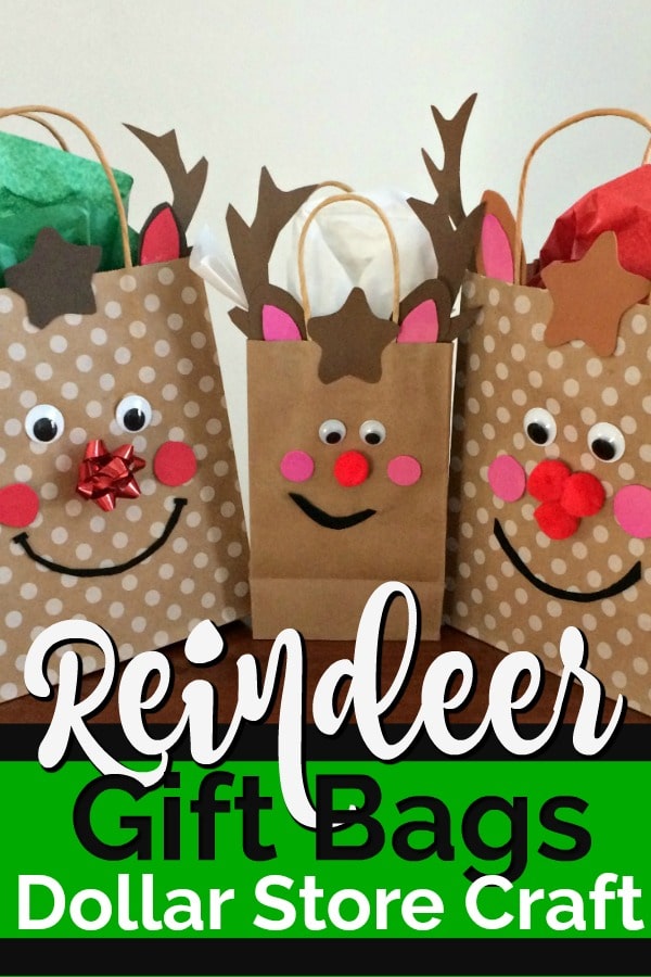 Three gift bags decorated with reindeer faces.