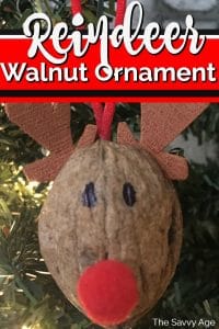 Reindeer ornament made of walnut shell.