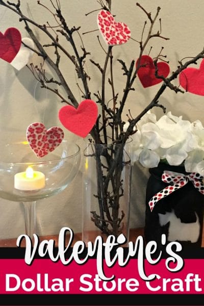 Valentine's Day tree with heart ornaments, mason jar painted with scottie dog amd lighted flameless candle on a mantel/