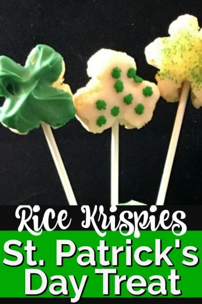Three lollipops in the shape of shamrocks made of rice krispies.