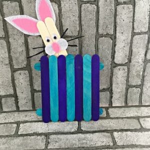 Popsicle Stick fence with a popsicle stick bunny peeking over top of fence.