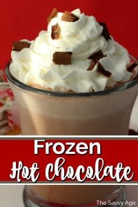 Mug of frozen hot chocolate with whipped cream on top and chocolate sprinkles.