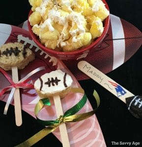 Two Football Lollipops - rice krispie treats shaped footballs on popsicle sticks.