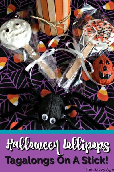 Black spider made from walnut, Halloween cookie Lollipops in orange and white decorated with Halloween sprinkles.