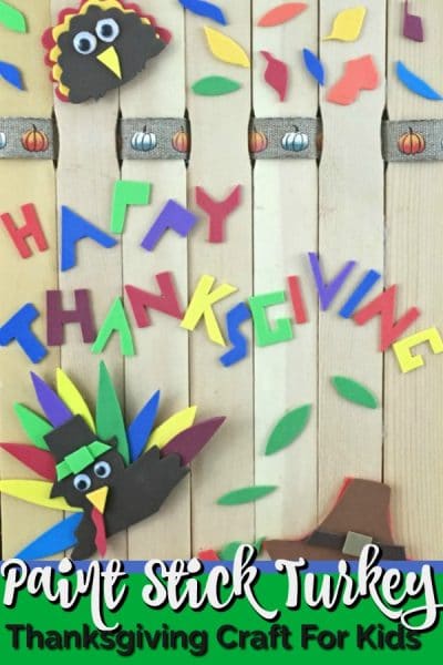 Paint stick background decorated with paper turkey, owl and leaves.