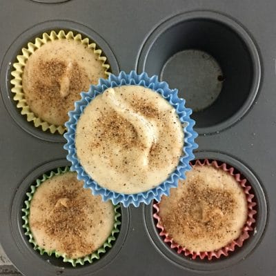 Muffin pan with fudge cups in muffin liners.