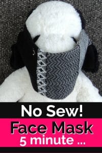 Stuffed Snoopy with a face mask made of a sock.