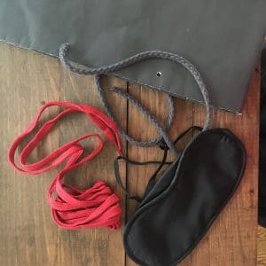 Red shoelaces, eye mask, shopping bag