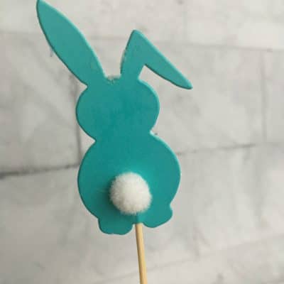 Aqua Bunny cupcake topper with white tail on a toothpick.