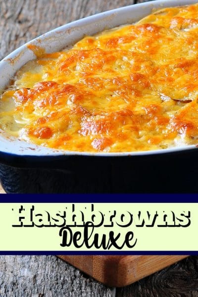 Blue baking dish with hashbrown and cheese casserole.