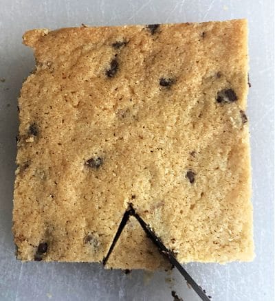 Square shaped cookie with a cut out of top.