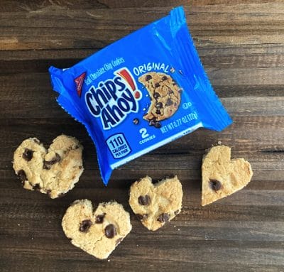 Package of chips ahoy cookies with cookies in a heart shape on a brown background.